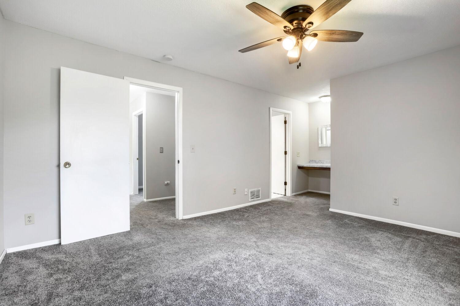 Upstairs Primary Bedroom with Vanity area and walk in closet