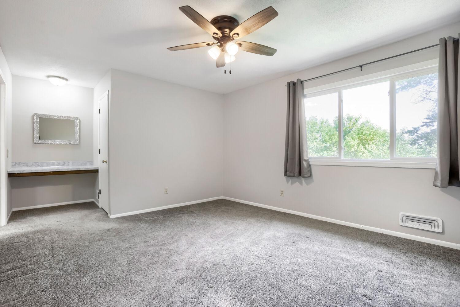 Upstairs Primary Bedroom with Vanity area and walk in closet