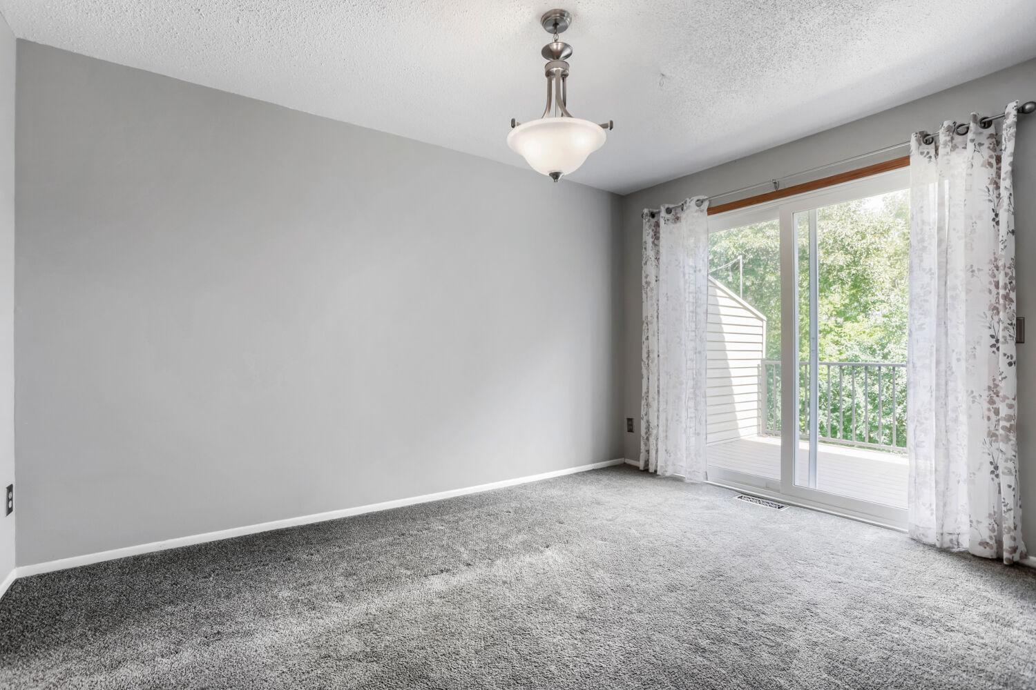 Main level living room with walkout to deck
