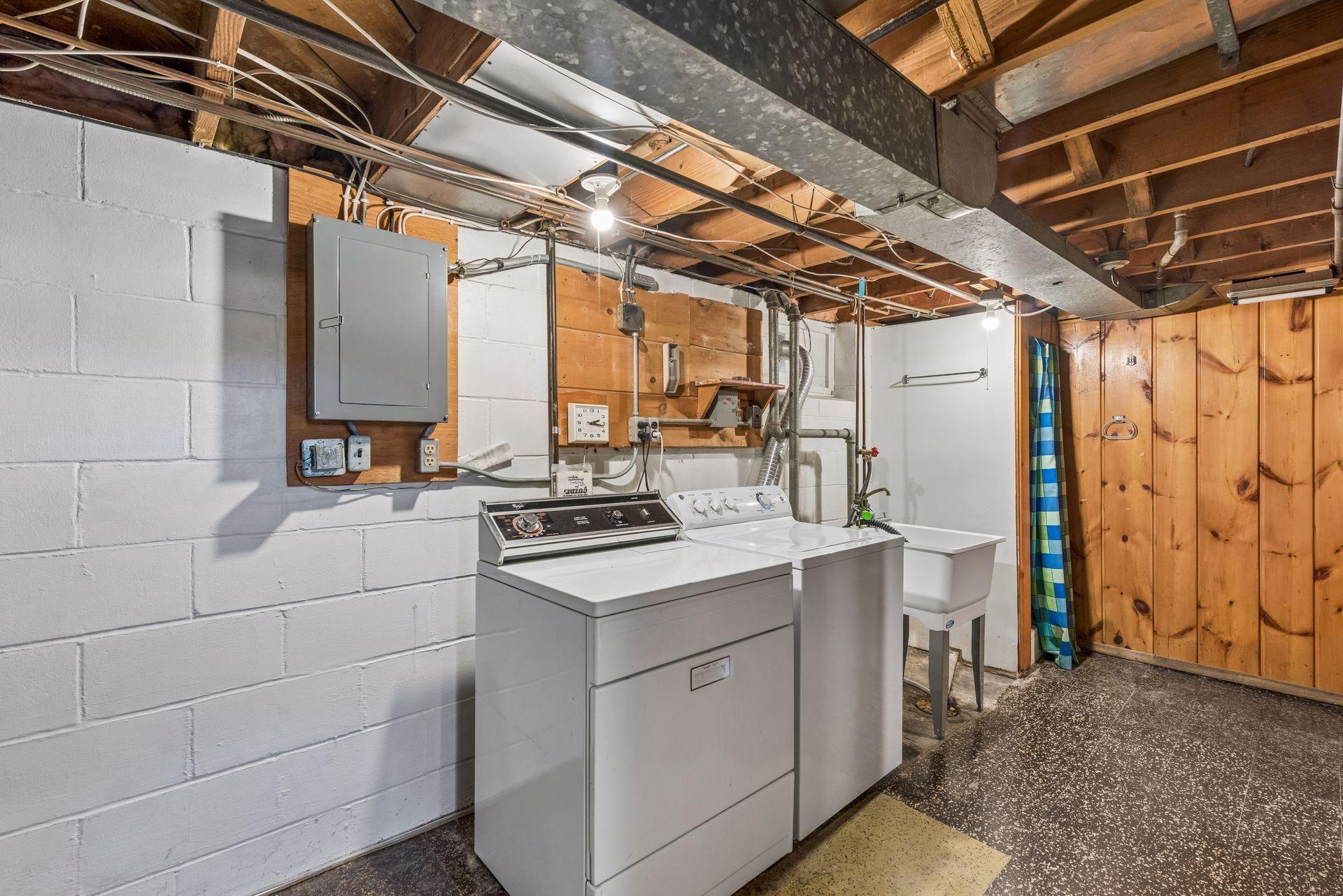 Lower Level laundry with utility sink and shower