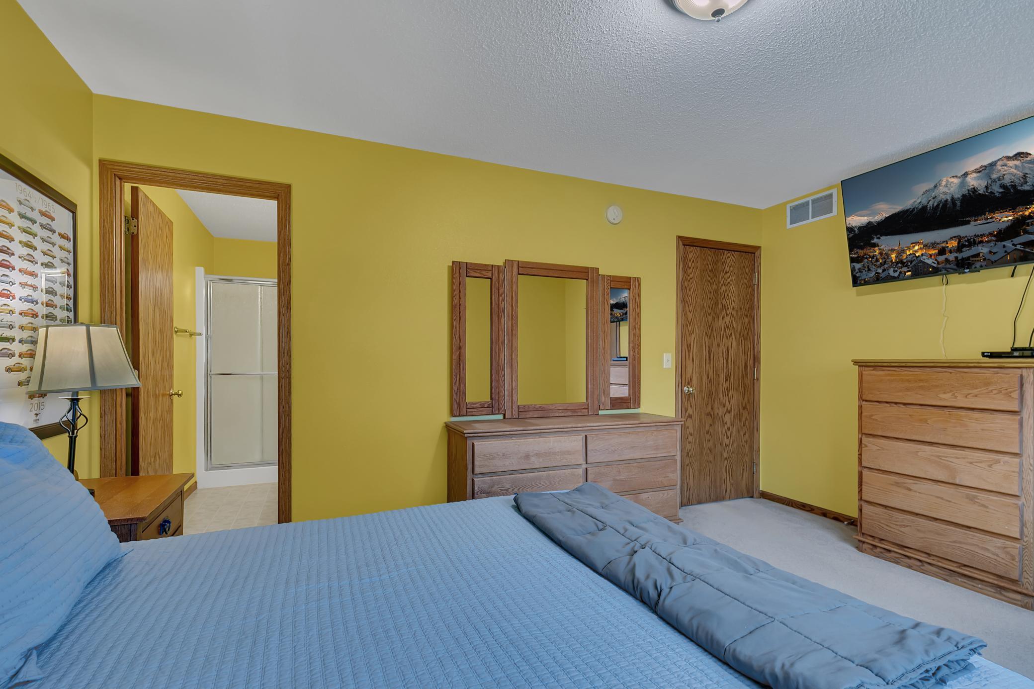 The primary bedroom includes a private three-quarter bathroom and walk-in closet.