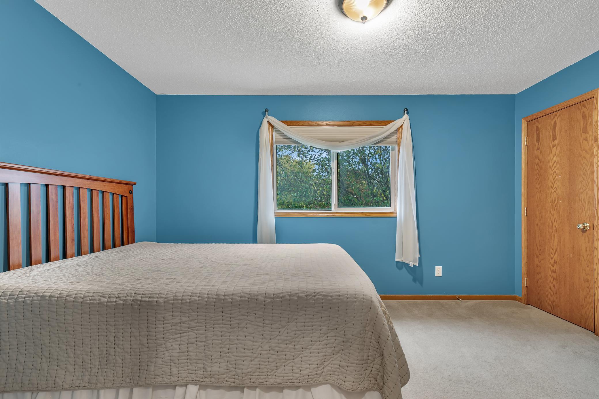 Here is the second upper level bedroom and it also features a walk-in closet.