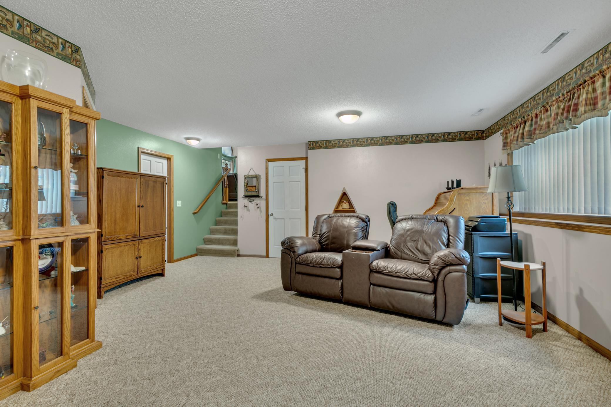 The third-level family room provides a comfortable gathering space.