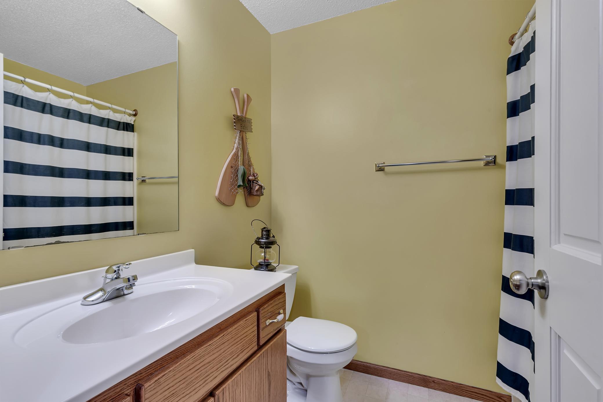 A full bathroom on this level adds convenience and flexibility for family members and guests.