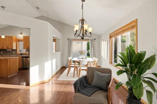 Separate dining area near the main-level fireplace sitting space. (virtually staged)