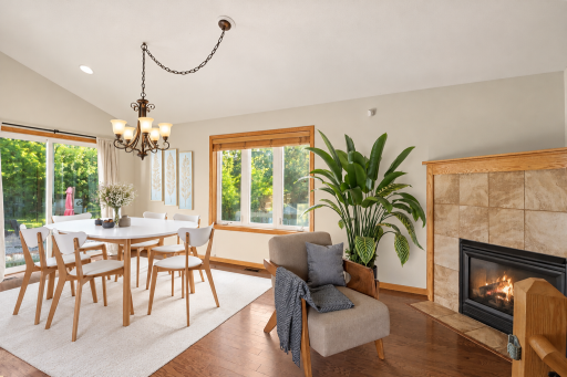 Second view of the main-level living room, highlighting hardwood floors and vaulted ceiling. (virtually staged).png