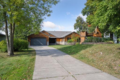 A long concrete driveway with playset welcomes you right in!