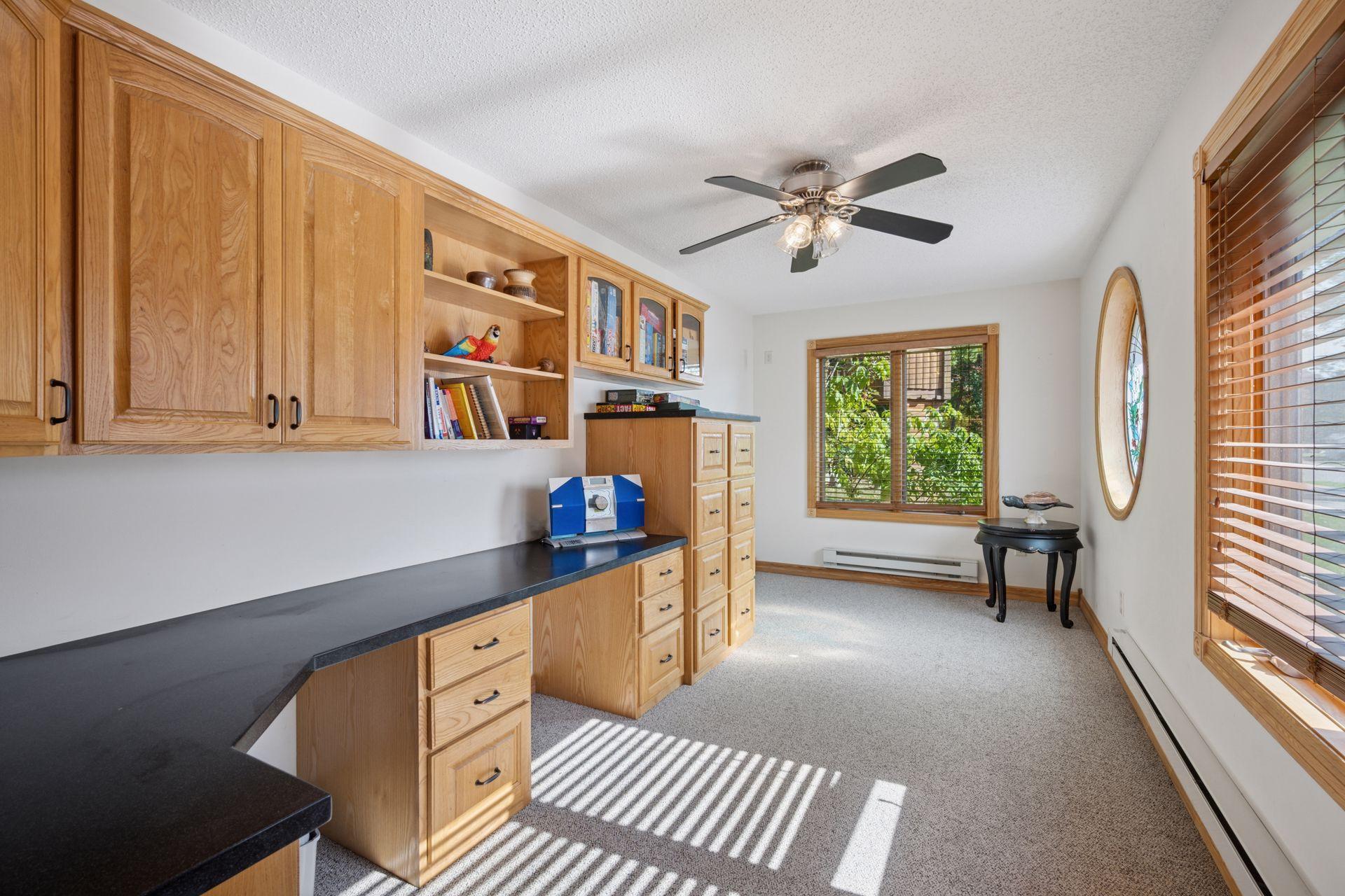 Main Floor Office is Large and Full of Storage