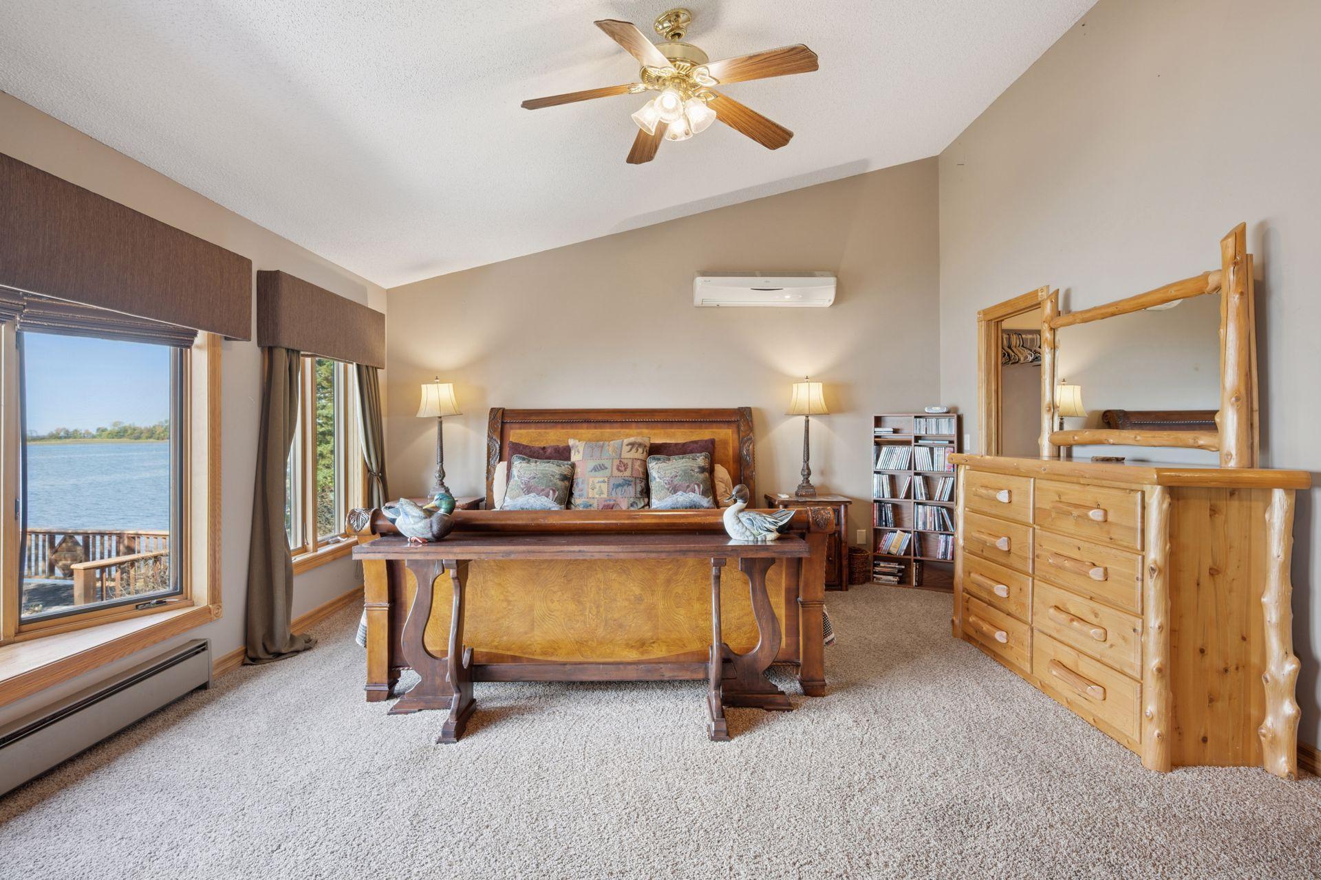 Grand Primary Bedroom with Vaulted Ceilings and Lake View