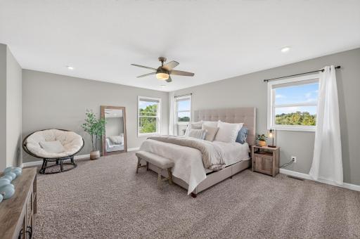 Beautiful Primary Suite with Modern Finishes and Generous Closet Space.