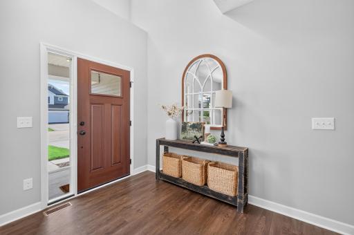 Inviting Two-Story Foyer with Welcoming Entry and Modern Finishes.