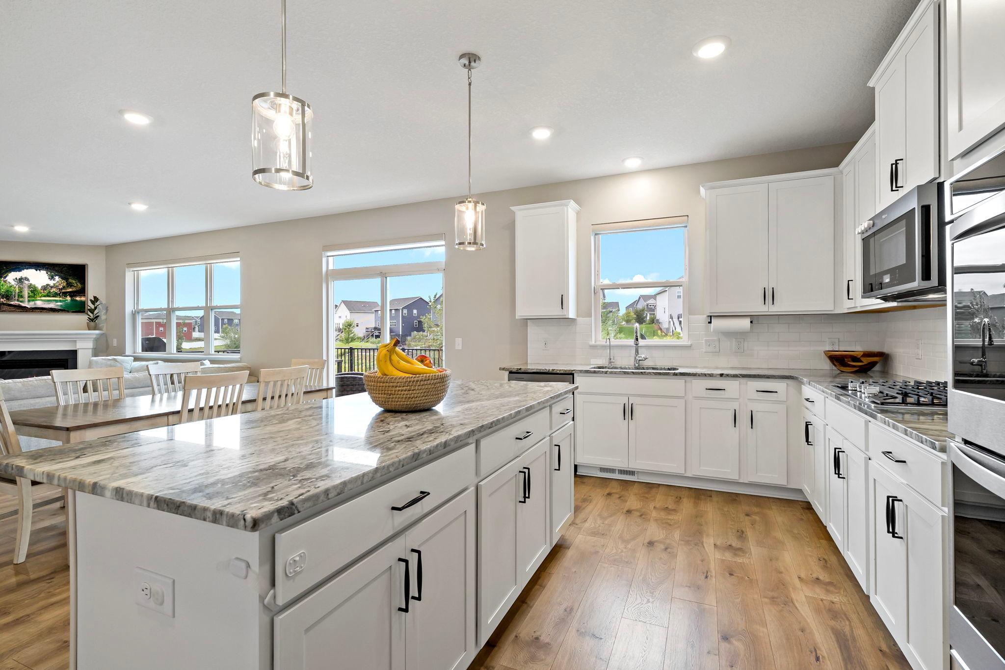 A great open floor plan with beautiful granite counters and subway tile backsplash.
