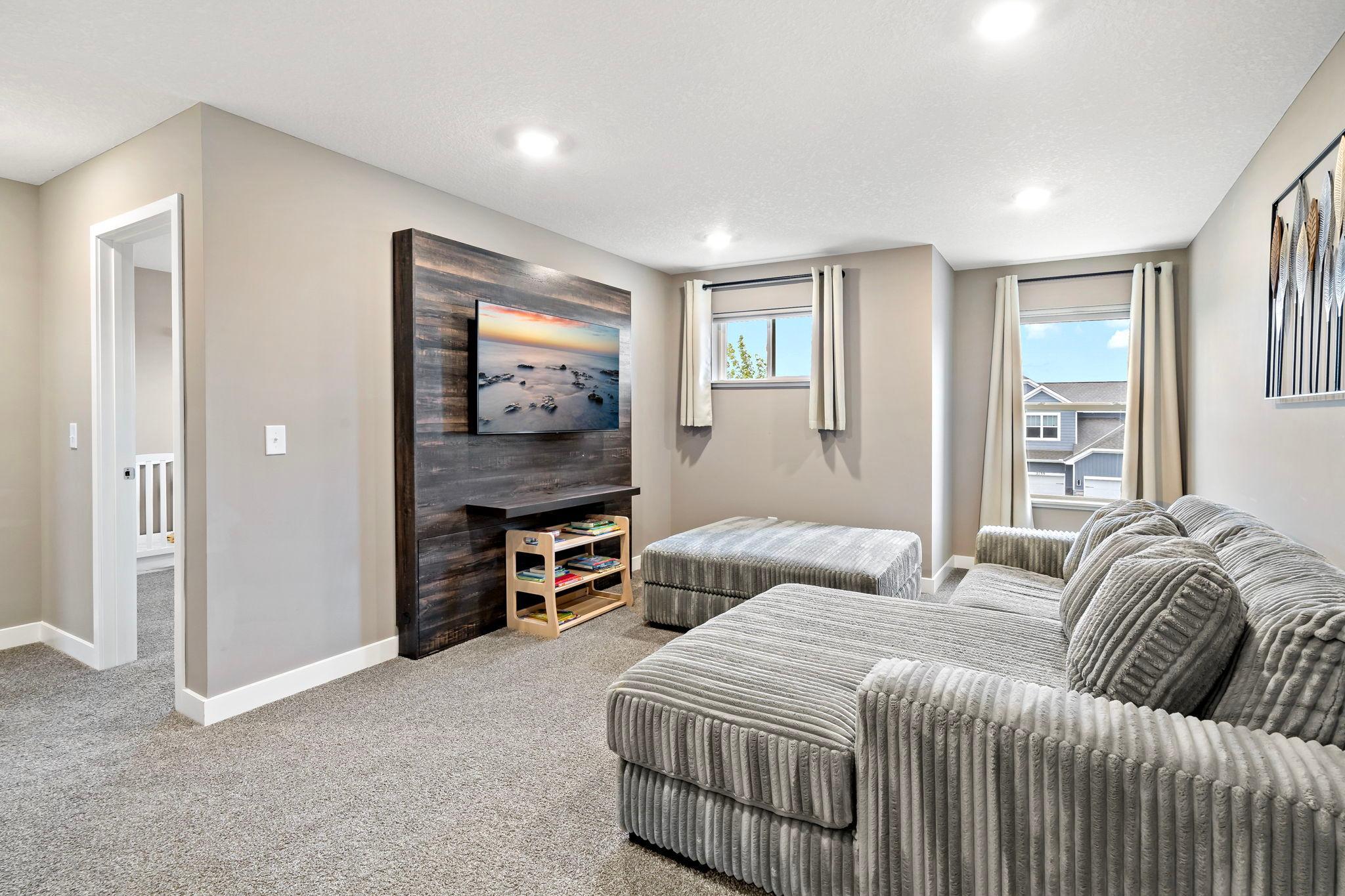 Spacious upper level loft area with built in storage, TV & mount included!