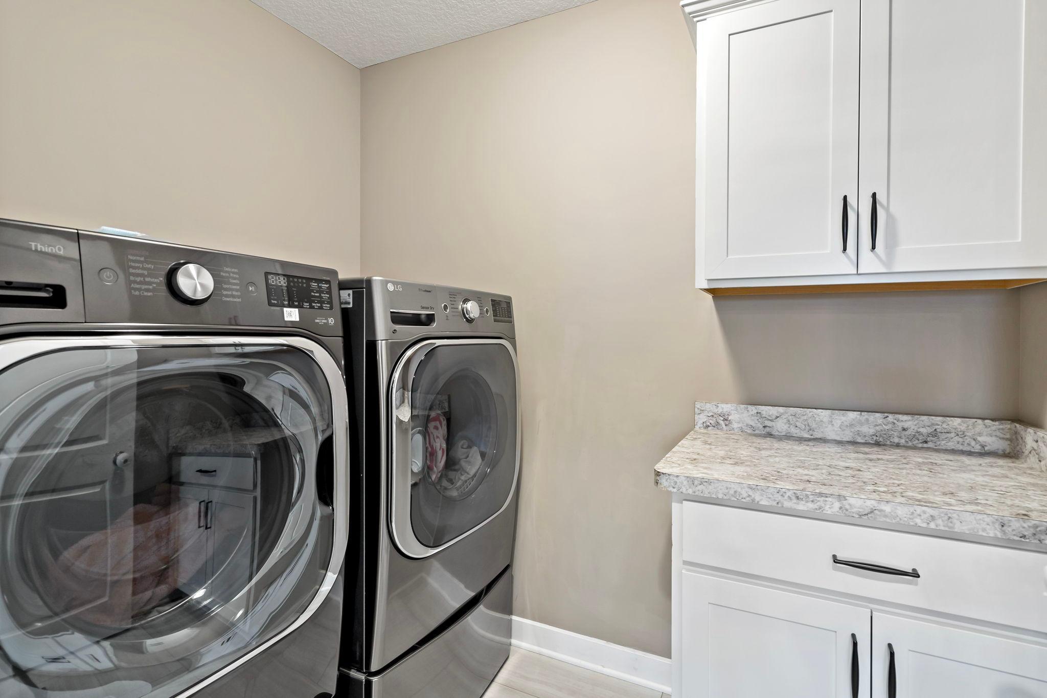 Upper level laundry room with storage!