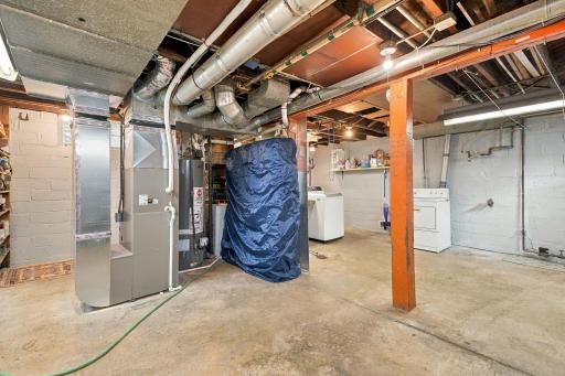 The lower level offers high ceilings, washer & dryer, and plenty of storage space.