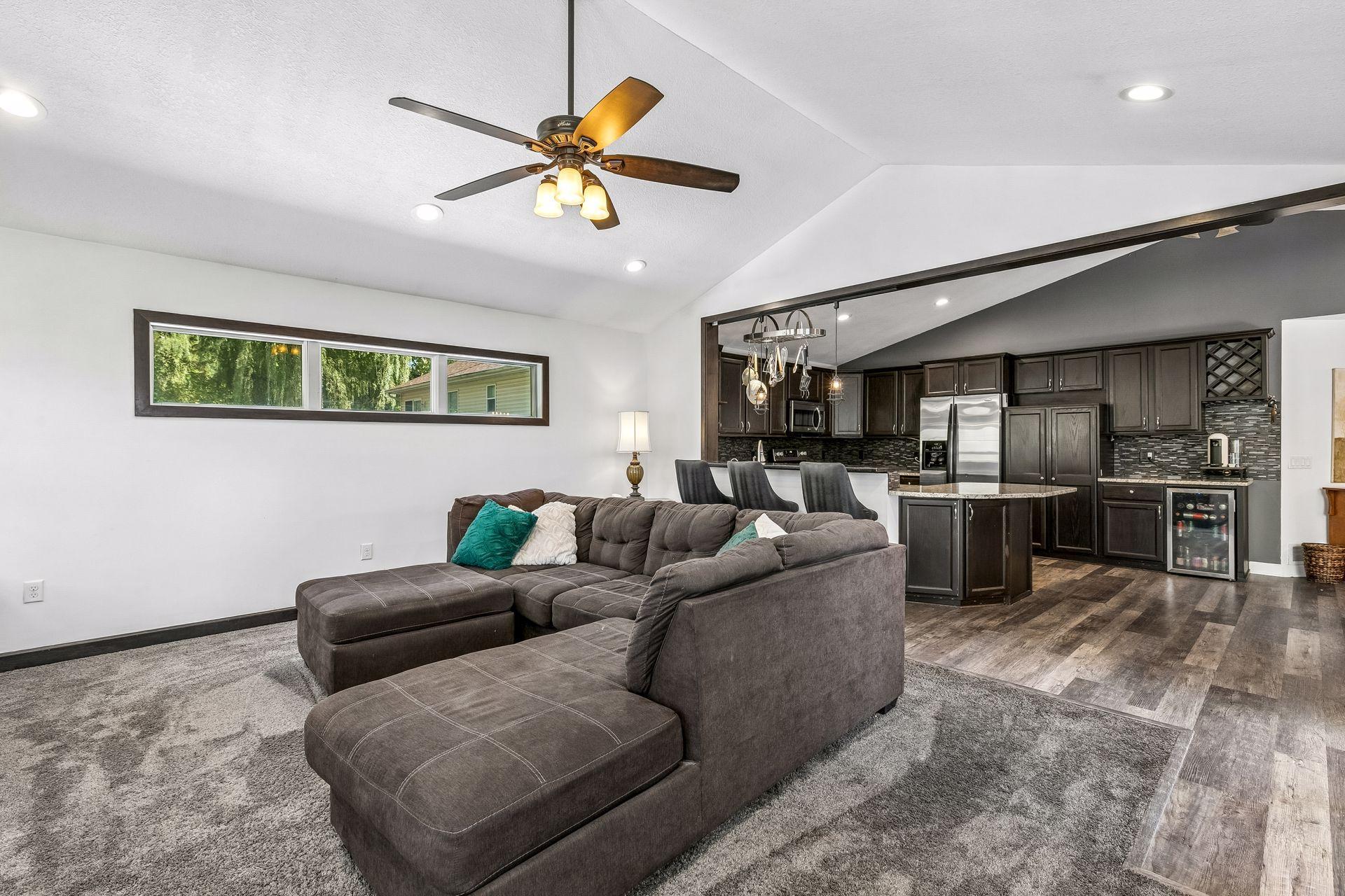 Living Room W/ Vaulted Ceilings & Fireplace