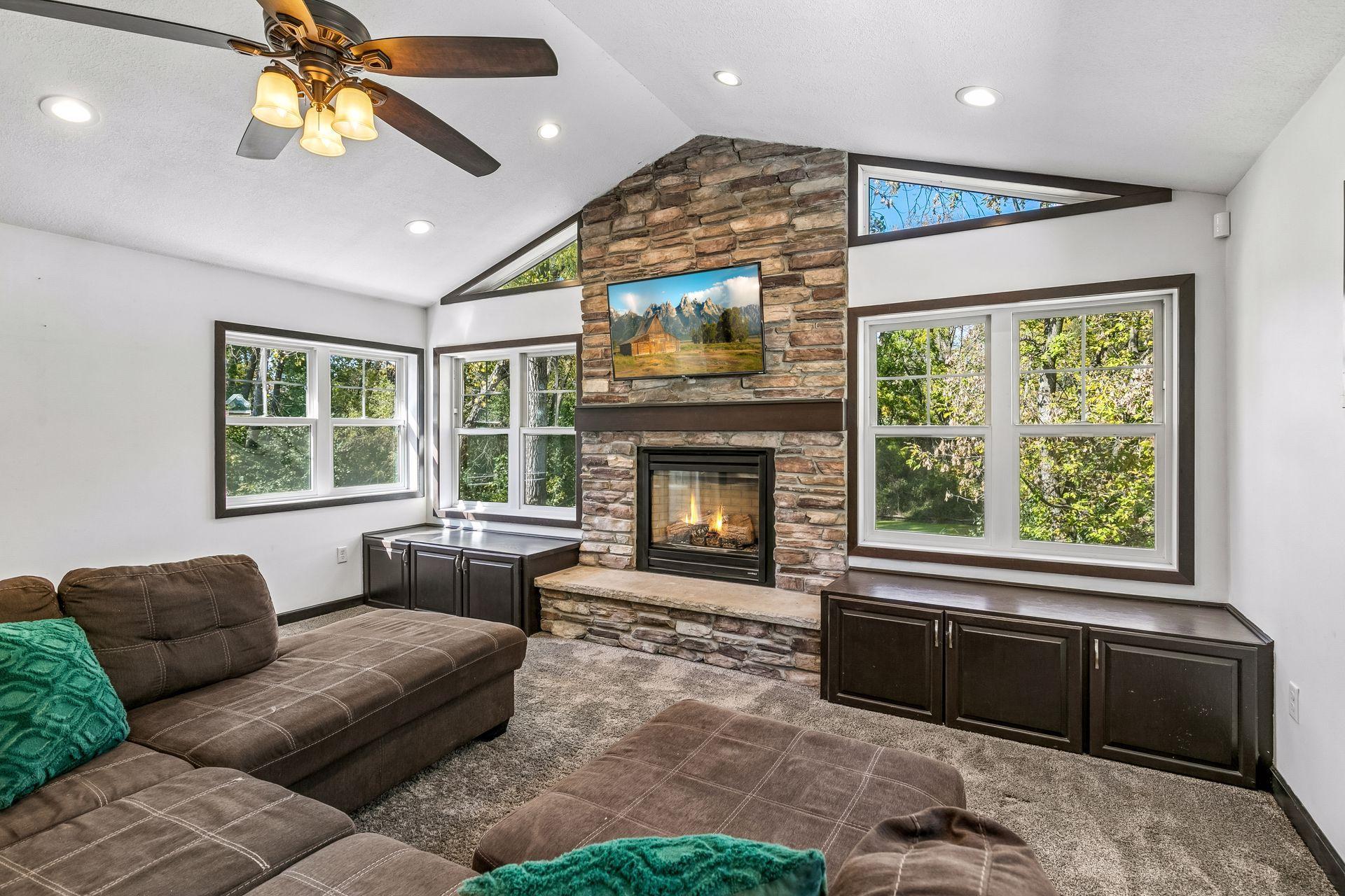 Living Room W/ Vaulted Ceilings & Fireplace