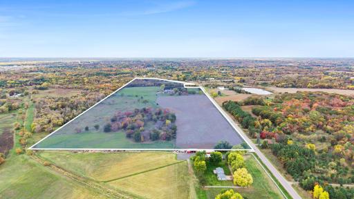 With generous stretches of open land and wooded areas, this property offers flexibility for a variety of future possibilities