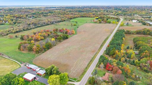 Wide-open agricultural land with convenient frontage along Constance Boulevard NE, offering excellent visibility and accessibility