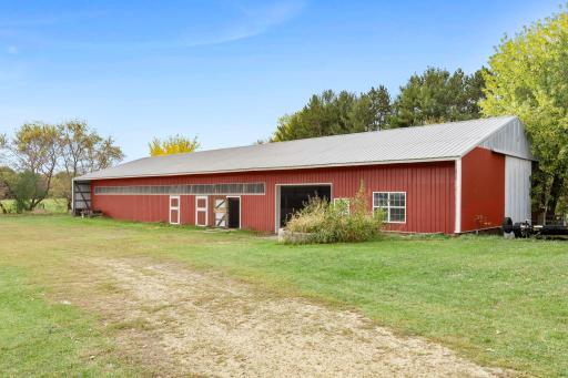 The spacious 40x130 horse barn features multiple stalls, a large 40x40 pen, and an insulated tack room, providing an established equestrian setup