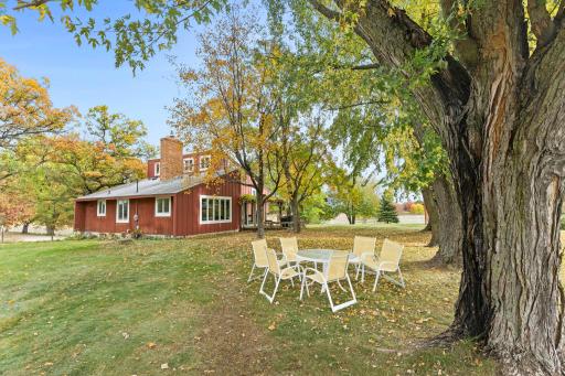 The established homesite offers a spacious yard surrounded by mature trees, providing a peaceful setting within the larger acreage