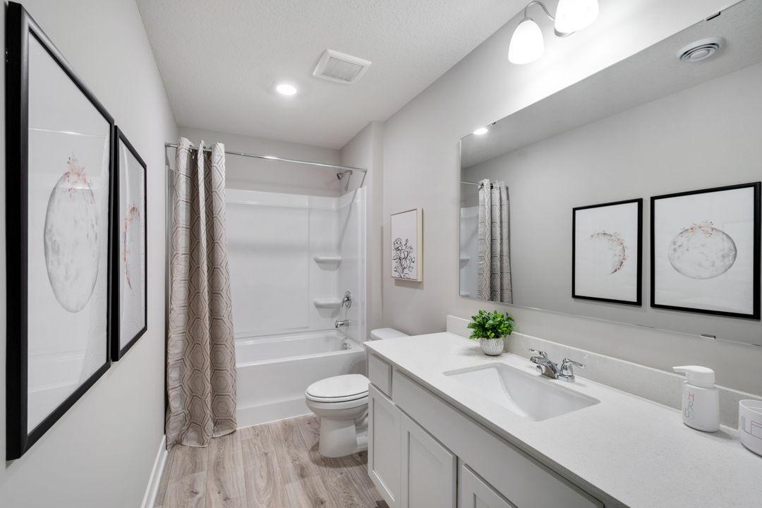 Spacious upper-Level common bath. Photo of model home. Colors and finishes may vary.