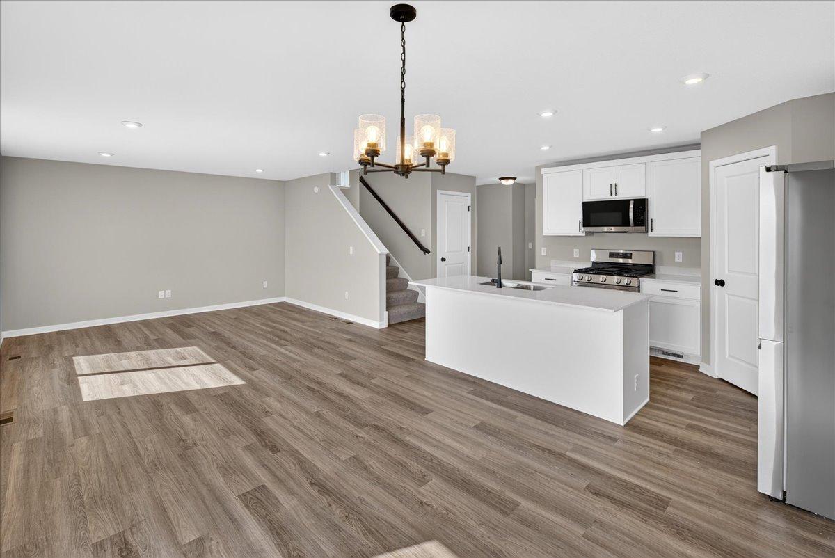 PHOTO OF A DIFFERENT HOME WITH SIMILAR PLAN AND FINISHES.