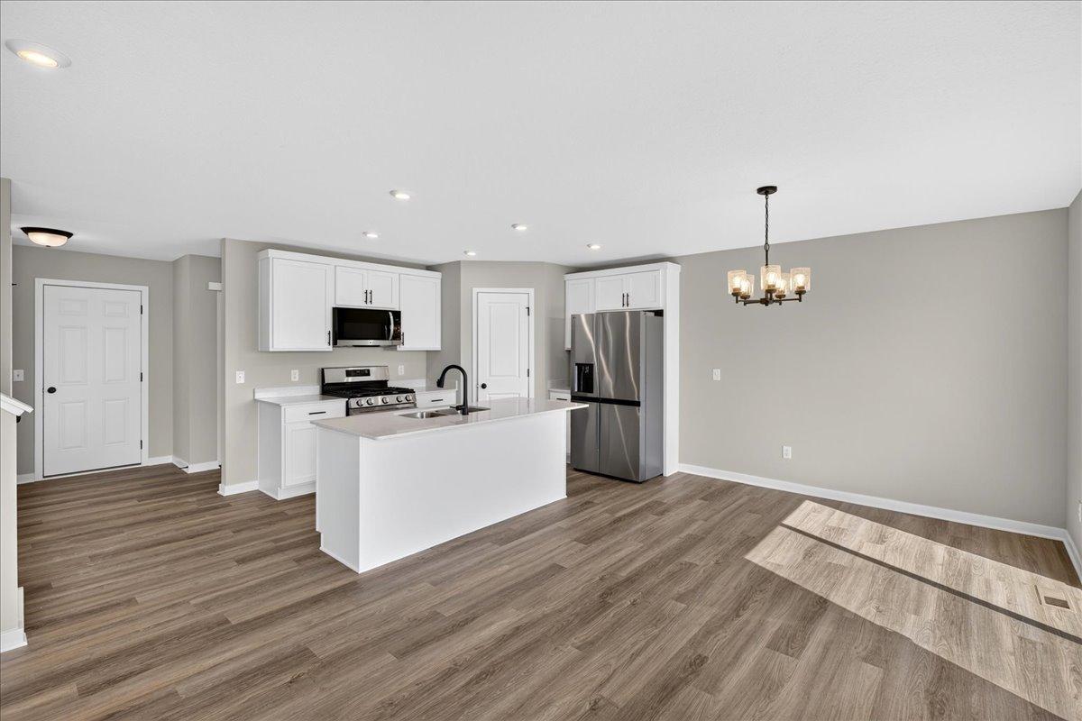 PHOTO OF A DIFFERENT HOME WITH SIMILAR PLAN AND FINISHES.