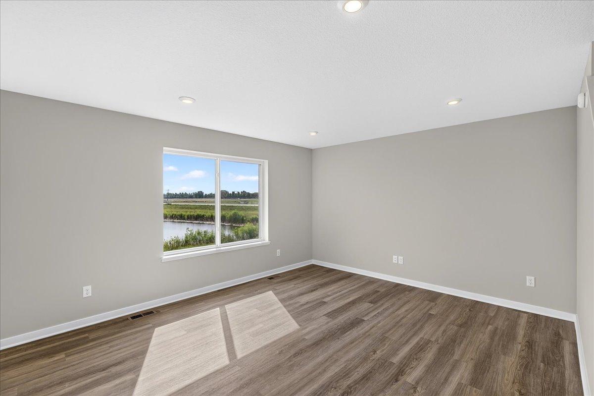 PHOTO OF A DIFFERENT HOME WITH SIMILAR PLAN AND FINISHES.