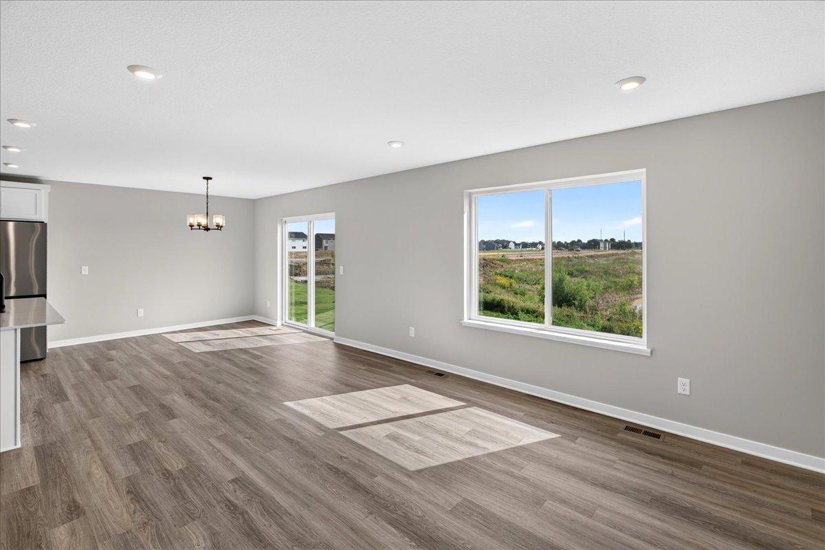 PHOTO OF A DIFFERENT HOME WITH SIMILAR PLAN AND FINISHES.