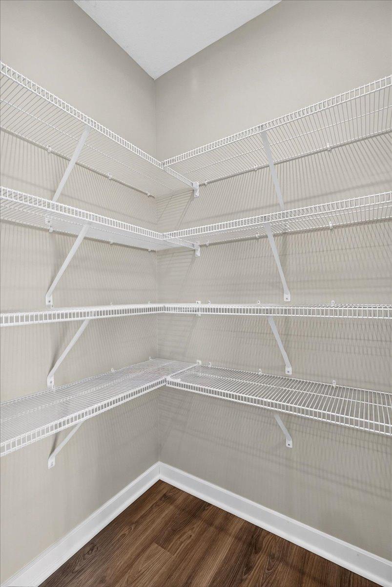 PHOTO OF A DIFFERENT HOME WITH SIMILAR PLAN AND FINISHES. Kitchen Pantry.