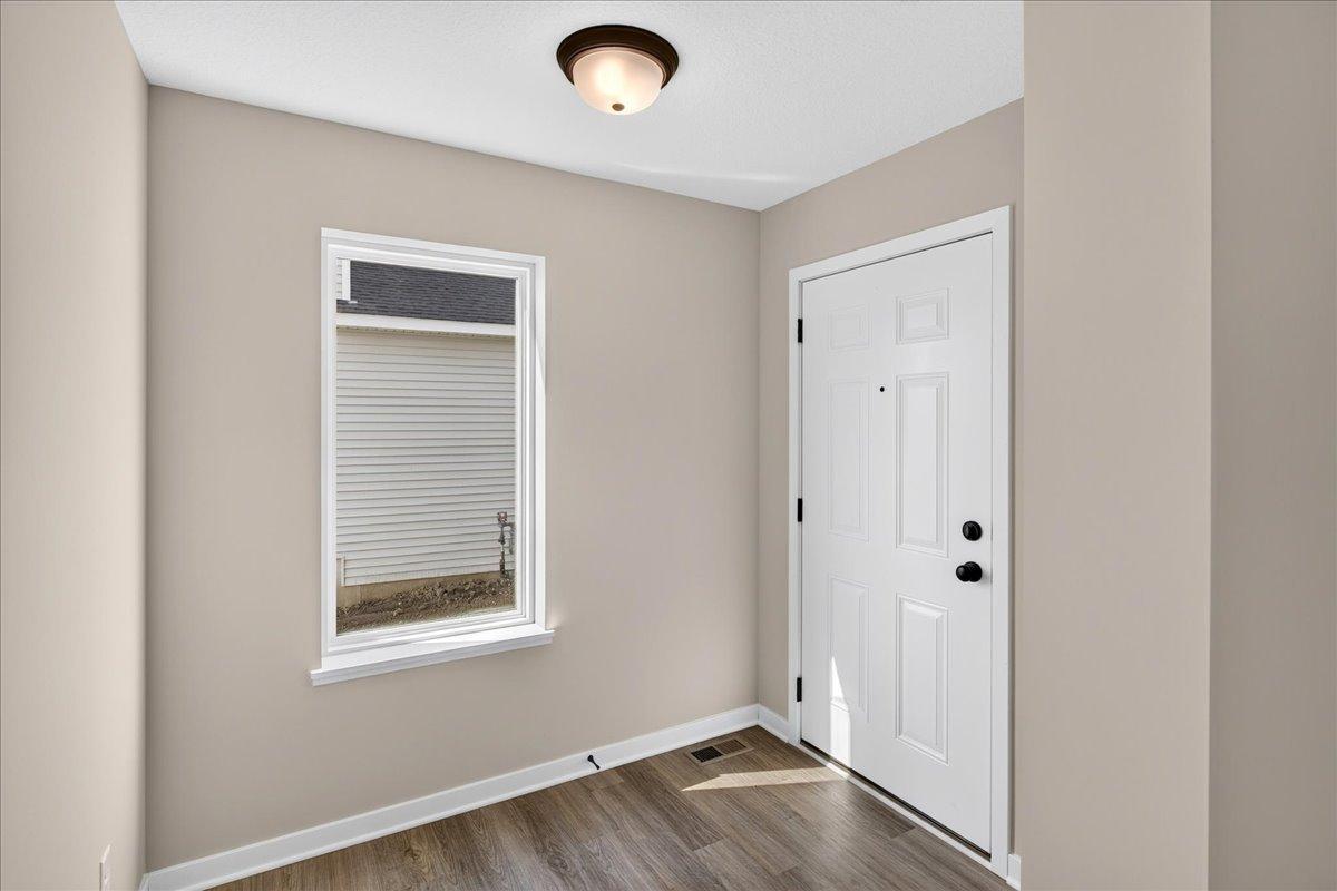PHOTO OF A DIFFERENT HOME WITH SIMILAR PLAN AND FINISHES.