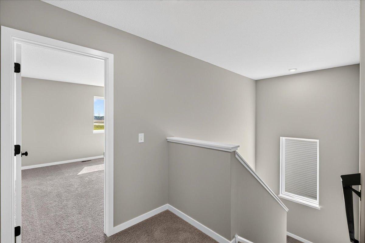 PHOTO OF A DIFFERENT HOME WITH SIMILAR PLAN AND FINISHES.