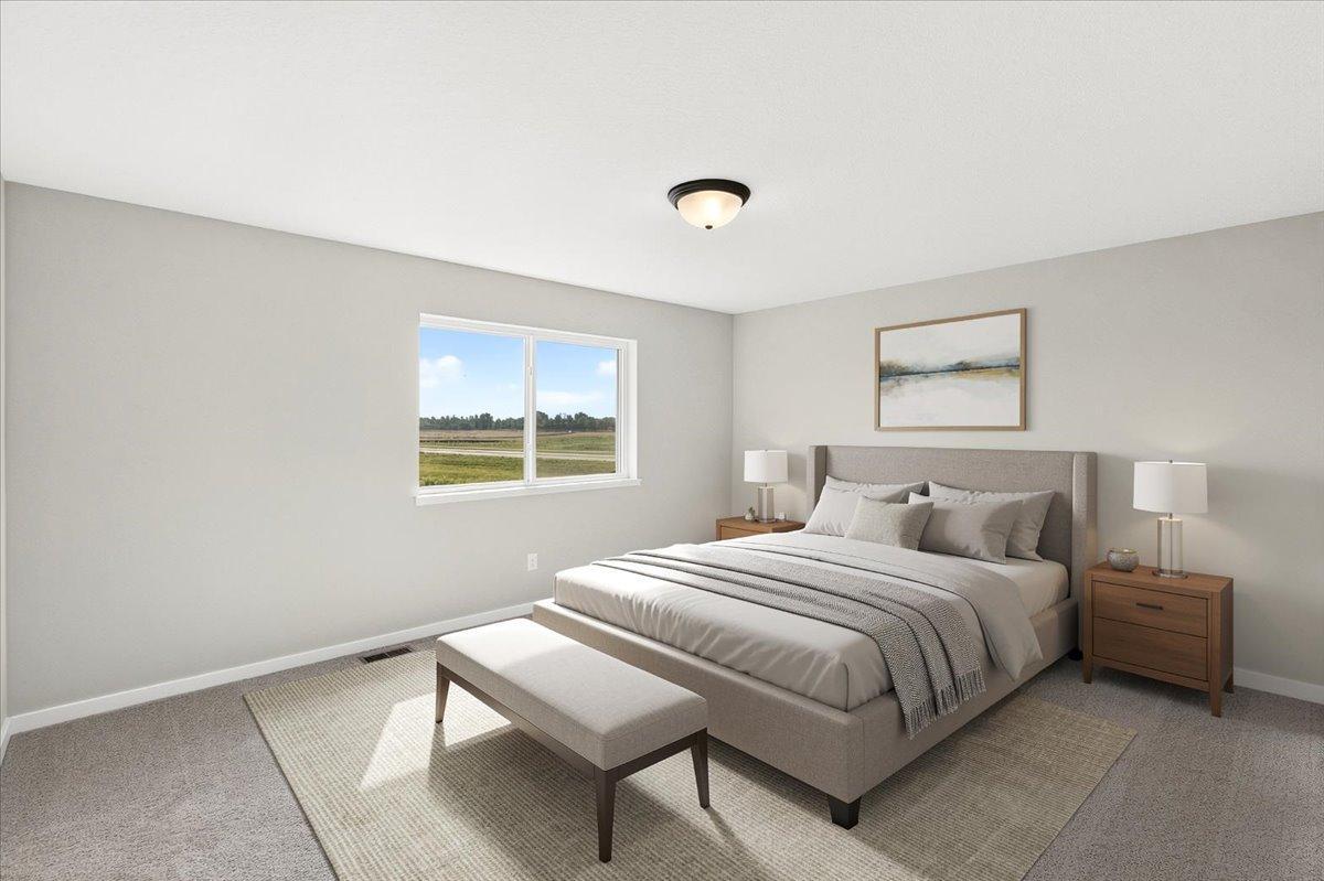 PHOTO OF A DIFFERENT HOME WITH SIMILAR PLAN AND FINISHES VIRTUALLY STAGED. Primary Suite.