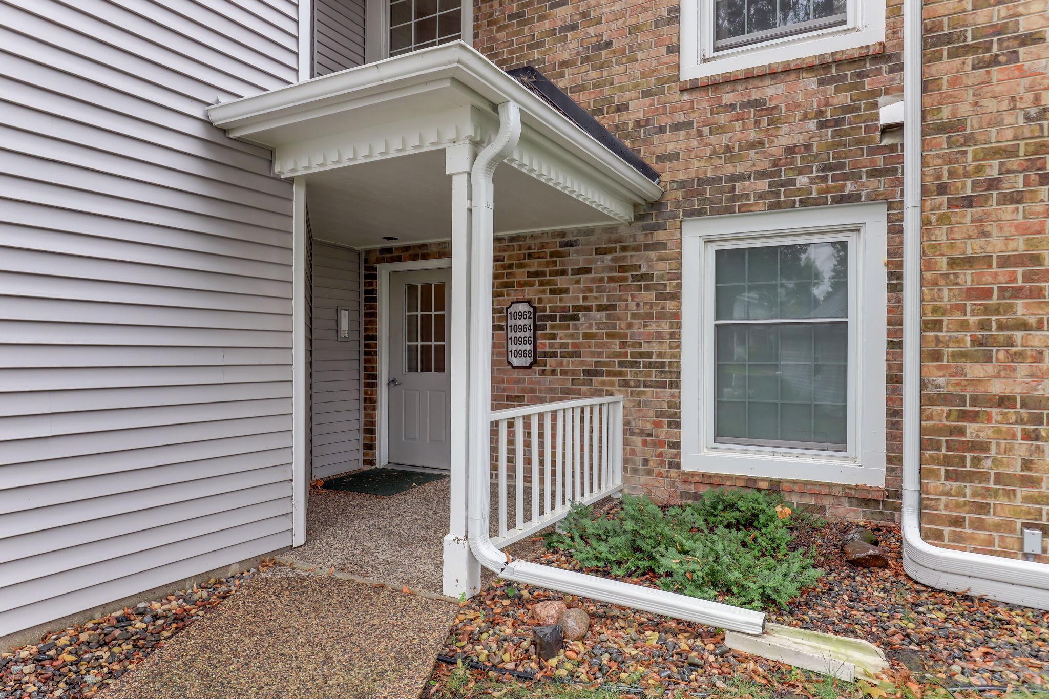 Covered entry provides a welcoming, sheltered approach to the building’s controlled access.