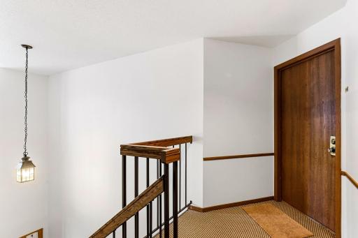 Upper-level entrance to the unit, located just steps from the common stairway.