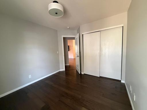 Spacious third bedroom featuring updated lightening and updated flooring.
