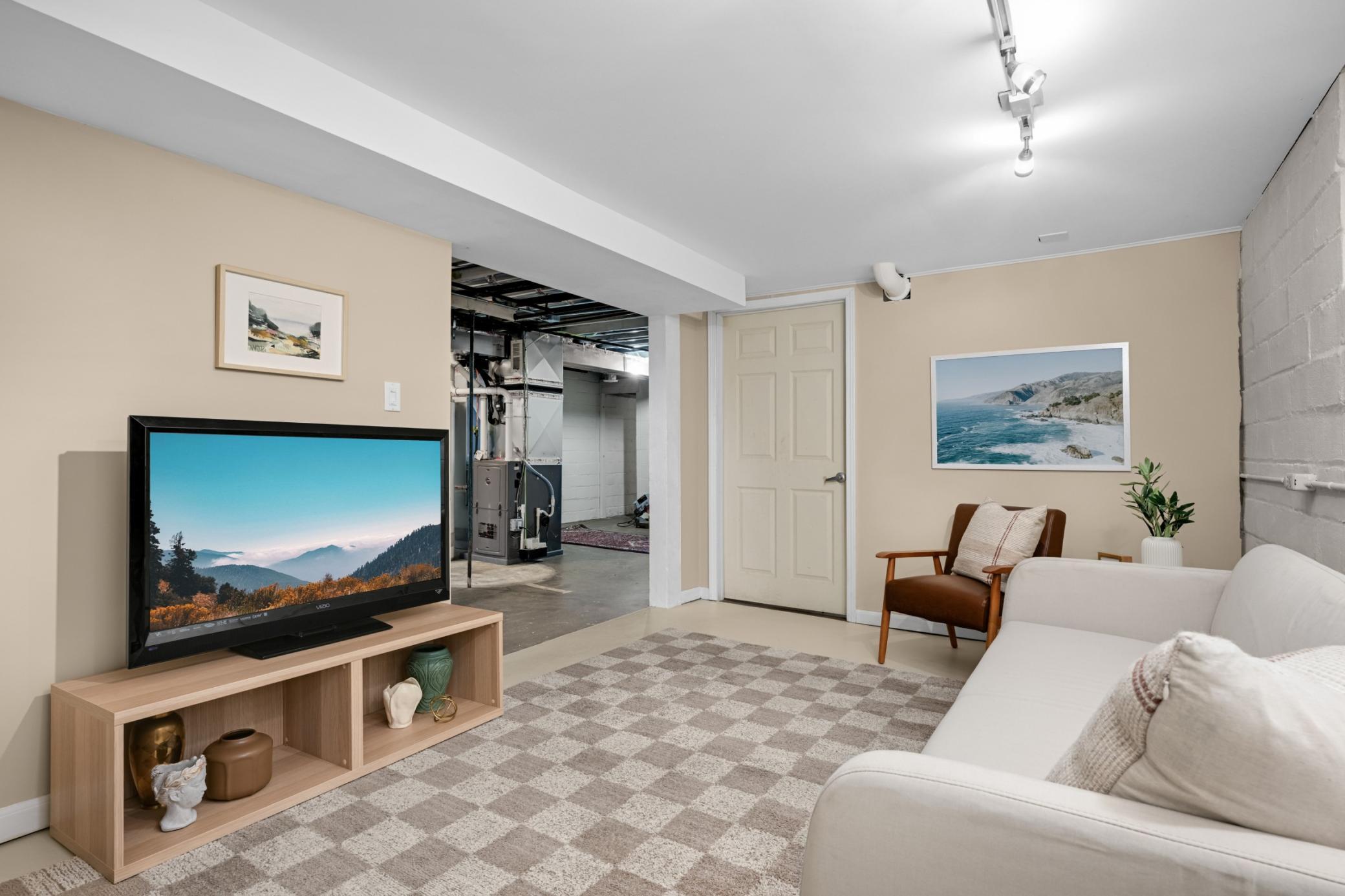 Family room on the lower level with only a small portion of the basement finished there is more potential to realize for the next owner.