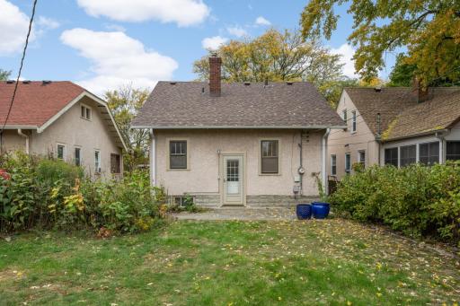 Enjoy the patio and lots of space for gardening in this partially privacy fenced backyard.