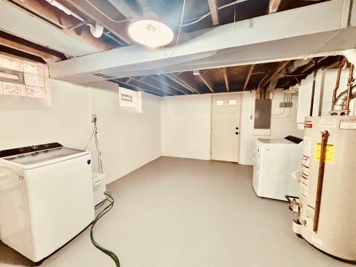 Clean laundry room, walk-out to back yard