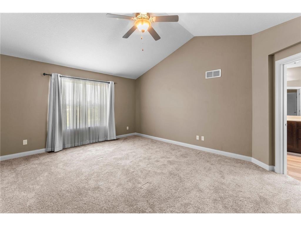 11 - Primary Bedroom with vaulted ceiling.jpeg