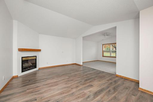 View as you come in the front door. LVP through out the main area of the unit with new carpet in the Sunroom (right side of photo) and 2 bedrooms.