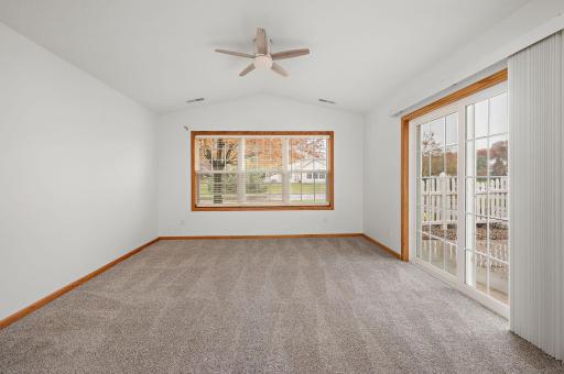 Light, bright cozy Sunroom that leads to the sunshine on the patio.