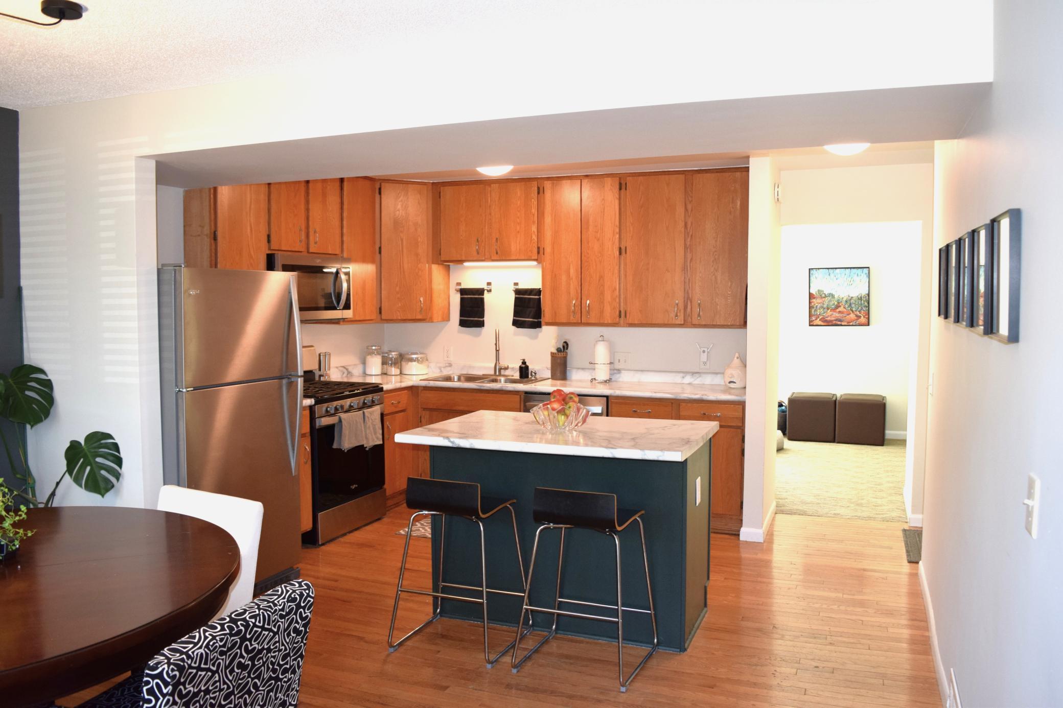 Unit 1 The open and airy floorplan fills with natural light and has gleaming hardwood floors!
