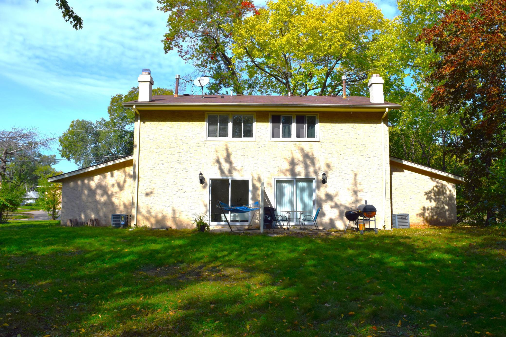 A view of the back of the property with each units private patio!