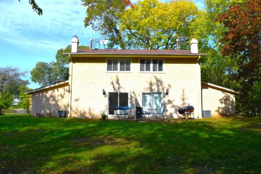 A view of the back of the property with each units private patio!