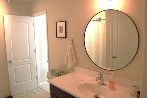 Unit 1 upper level bath. Three of the four toilets in this property were replaced in 2026!