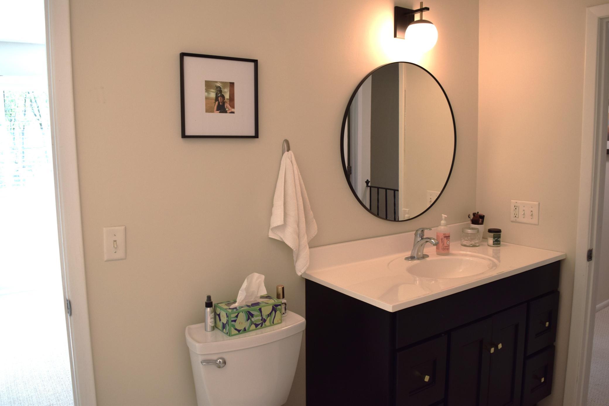 Unit 1 The upper level full bath was remodeled with new vanity, faucet, mirror and tub surround in 2023!