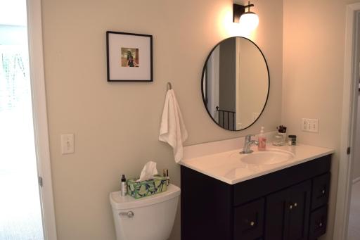 Unit 1 The upper level full bath was remodeled with new vanity, faucet, mirror and tub surround in 2023!