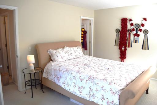 Unit 1 The spacious upper level primary suite has southern exposure as well and fills with natural light and overlooks the backyard!